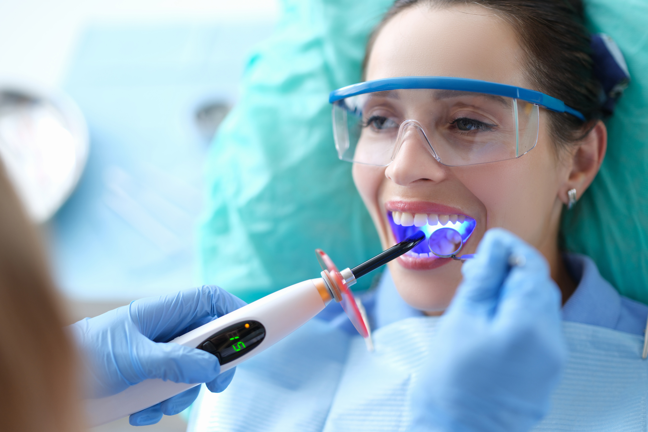 Dentist in Huntsville, AL performing gentle root canal treatment on a patient